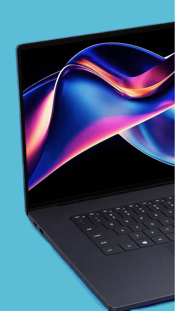A dark gray laptop with a black keyboard and trackpad, shown open against a solid light blue background. The screen displays a colorful abstract wallpaper and a small inset showing a video player interface.